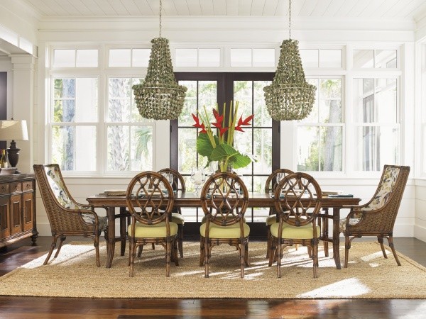 luxury dining room with brown wood dining room table with eight brown wicker chairs