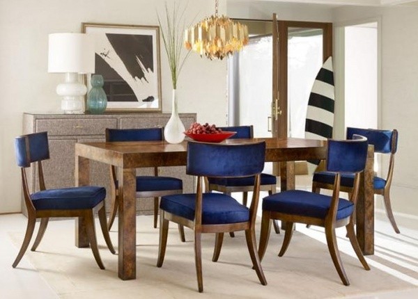 luxury dining room with brown wooden dining room table with blue and brown chairs