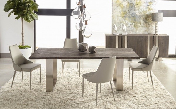 luxury dining room with brown wooden table with four cream colored chairs and cream shag rug