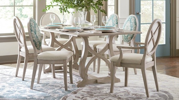 luxury dining room with white wood dining room table with settings for six people with six white and teal chairs