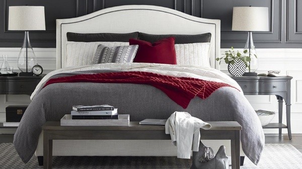 luxury home furniture master suite with grey white and red color scheme, featuring bed, wood nightstands and end table
