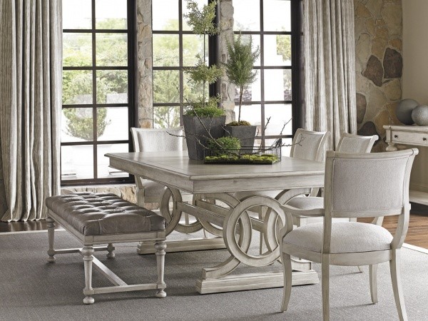 luxury dining room with white wood dining room table, four white chairs and a white and grey bench