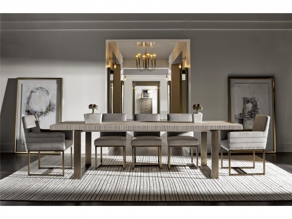 luxury dining room with brown dining room table with five table settings and grey chairs