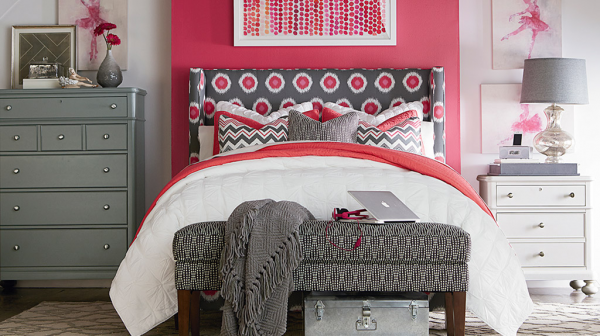 luxury finished interior bedroom with red white and grey color scheme with grey nightstands