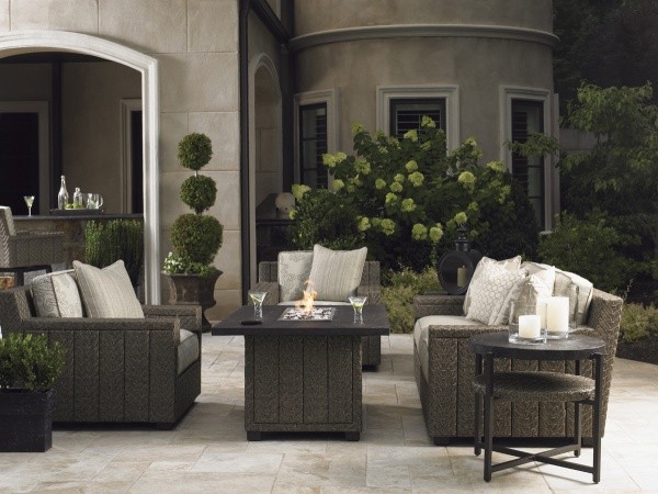 luxury patio including brown sofa, chairs, and square top table with round top end table