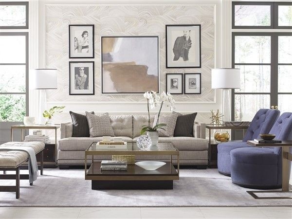 luxury living room featuring grey sofa with light blue chairs and glass top table