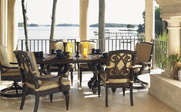 luxury patio including luxurious outdoor dining set with six wood and tan chairs