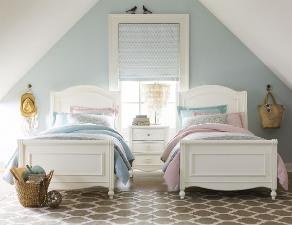 luxury finished interior bedroom with white beds with pastel sheets and walls