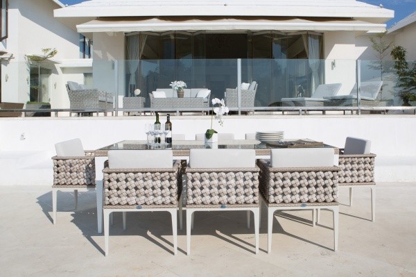 luxury patio including white and tan dining set with eight chairs