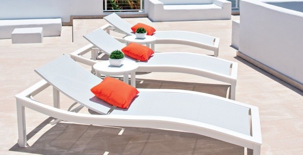 luxury patio including 3 modern design white deck chairs with orange pillows