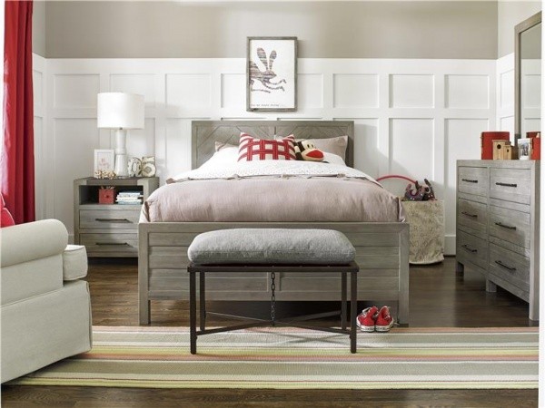 luxury finished interior bedroom with grey wood motif with red, white and grey bedding with grey furniture