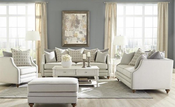 luxury living room featuring grey and white color scheme with white sofas and chairs with white wooden furniture
