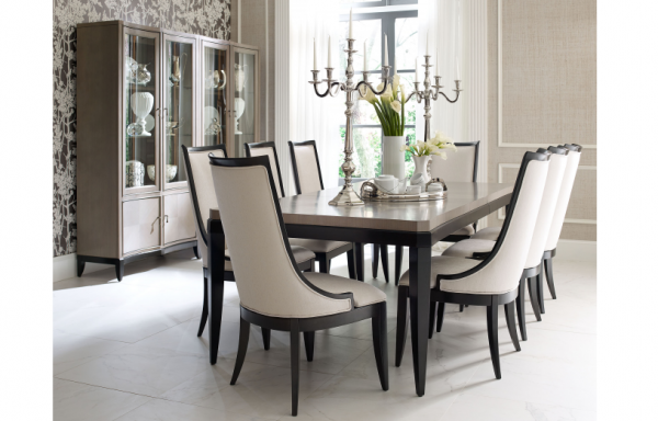 luxury dining room with grey and black table with 8 cream and black chairs with silver accents