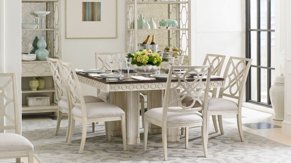 luxury dining room with seating for six featuring a white wooden table and six white chairs