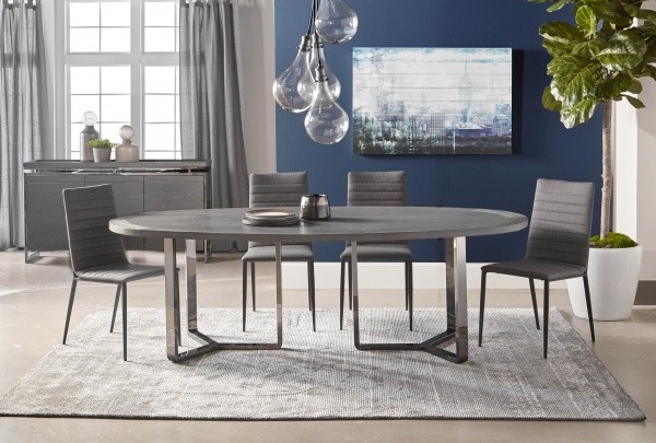 luxury dining room with round grey table and four grey chairs with a grey rug