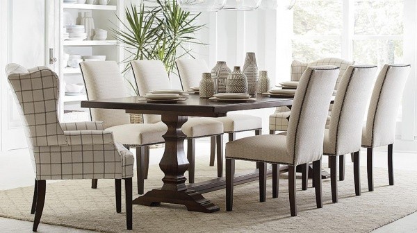 luxury dining room with eight chair brown wooden dining room table and cream colored rug