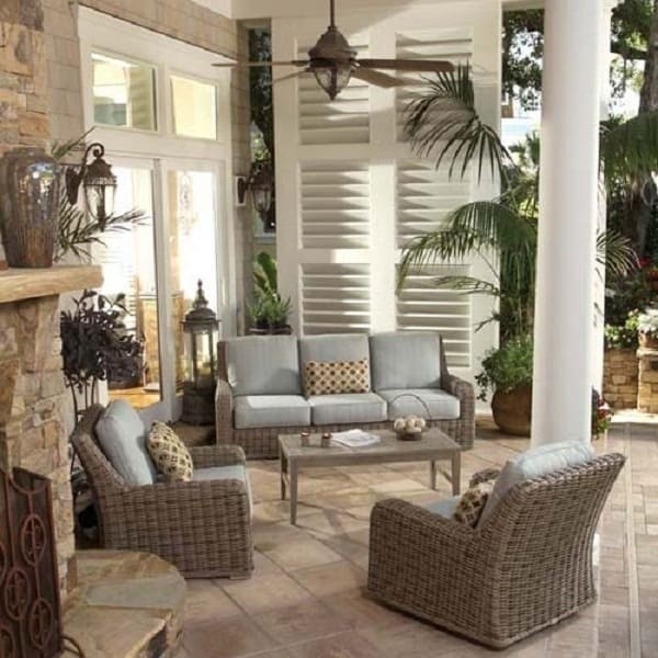luxury patio including cloth and wicker sofa and chairs with light brown table
