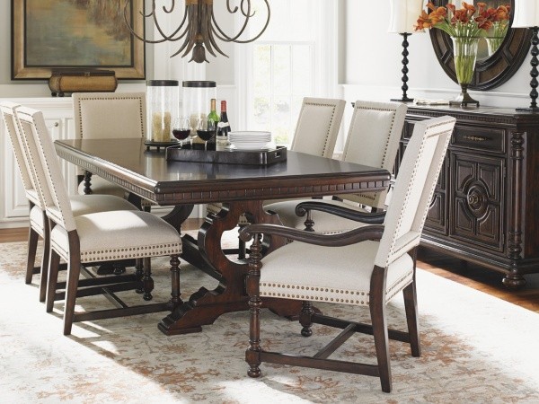 luxury dining room with dark wood dining room table with white leather and wood chairs