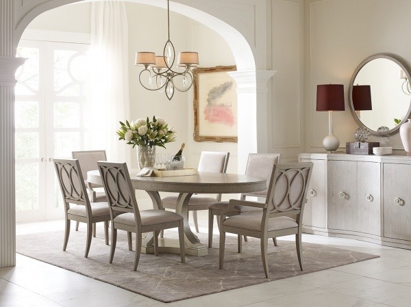 luxury dining room with light grey color scheme with grey oblong table and seating for six.