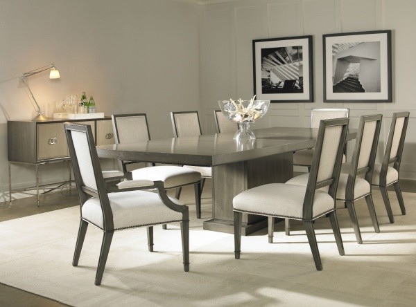luxury dining room with grey wooden table and eight grey and cream chairs