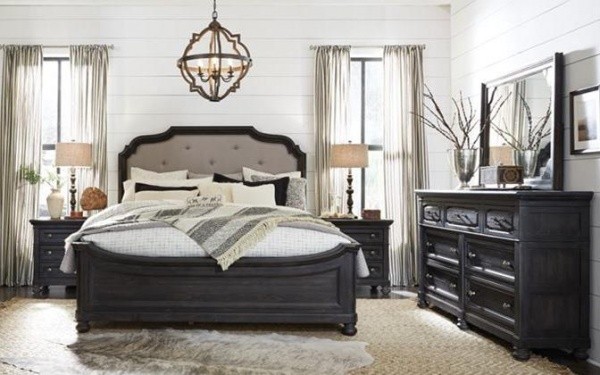 luxury home furniture master bedroom with black bed frame, black wood furniture and white, cream, grey and black bedding
