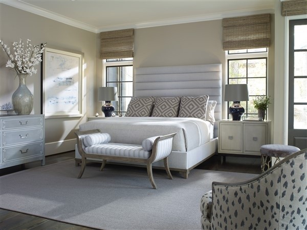 luxury home furniture master bedroom with white bed, tan colored walls and accents and grey dressers