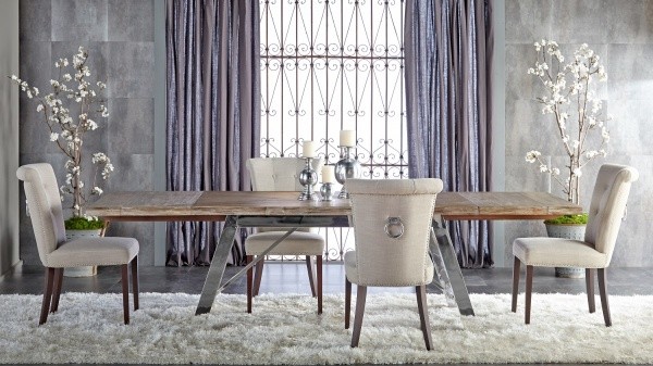 luxury dining room with large wood dining room table and four chairs with white shag run and purple accents