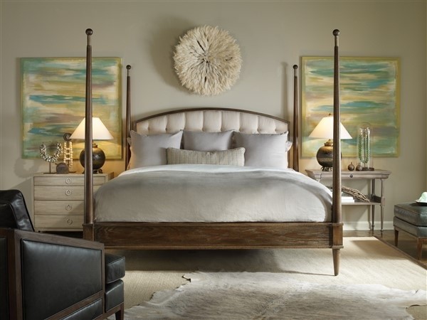 luxury home furniture master bedroom with white bedding, wood bed frame, and antiqued off white furniture