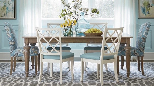 luxury dining room with cyan, white and brown color scheme with brown table, and white and cyan chairs