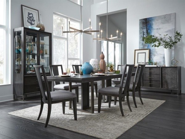 luxury dining room with black dining room table with six black chairs with grey area rug
