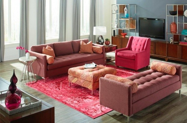 luxury living room featuring pink color scheme with red sofas and pinks chairs and rug