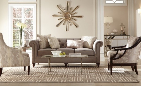 luxury living room featuring grey color scheme, grey sofa with grey chairs and grey area rug