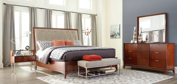 luxury home furniture master bedroom with wood bed frame, wood dresser and blue and orange color scheme