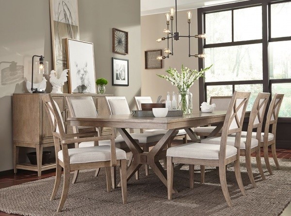 luxury dining room with brown wooden table with eight white and wood chairs with white accents