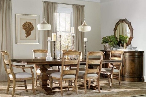 luxury dining room with wooden table and seating for six with light brown wooden chairs