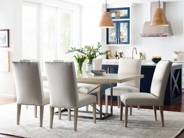 luxury dining room with light grey colored table with six light grey colored chairs