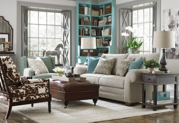 luxury living room featuring cyan and white color scheme with couch and chair with leather ottoman and palomino chair