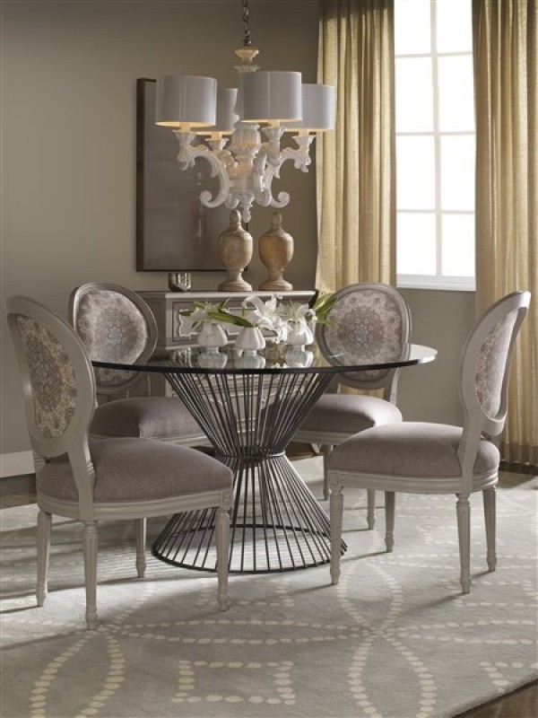 luxury dining room with round metal dining room table with four chairs