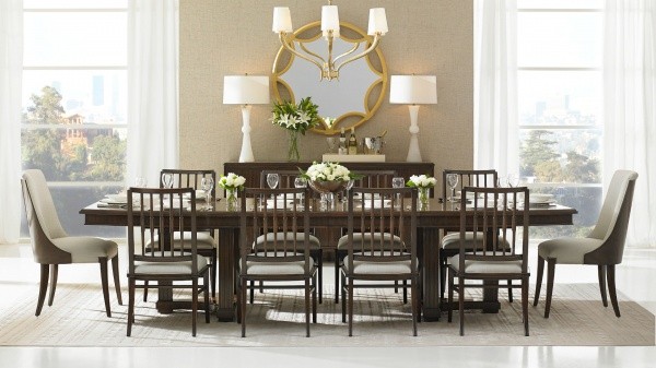 luxury dining room with wood dining room table and ten wood chairs with cream seats and backs
